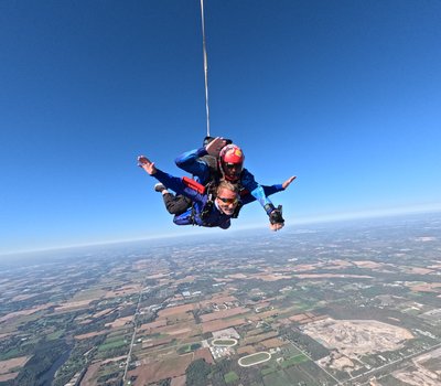 Tandem freefall above the patchwork farmland of southern Ontario
