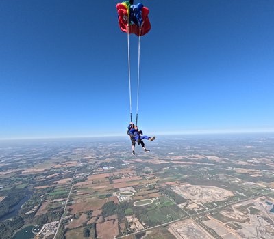 Tandem parachute ride over the fields near the Niagara Escarpment