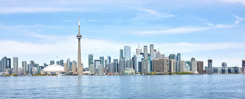 The Toronto skyline and CN Tower across Lake Ontario on a clear summer day